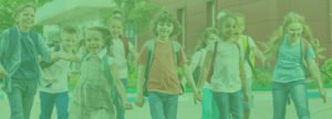 Elementary students leaving school together with green overlay