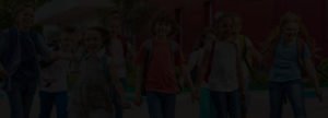 Kids leaving school together with black overlay