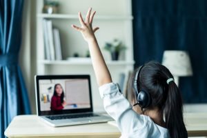 Student Raising Hand in personalized online learning class