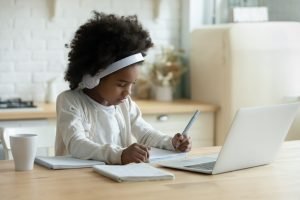 Girl doing school work at home